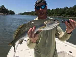 Man holding trophy size speckled trout