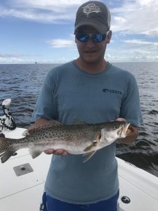 man holding nice speckled trout