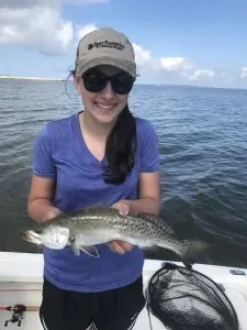 girl holding speckled trout