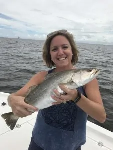 lady holding speckled trout