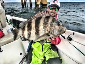 Captain Patric Garmeson holding current alabama state record sheepshead