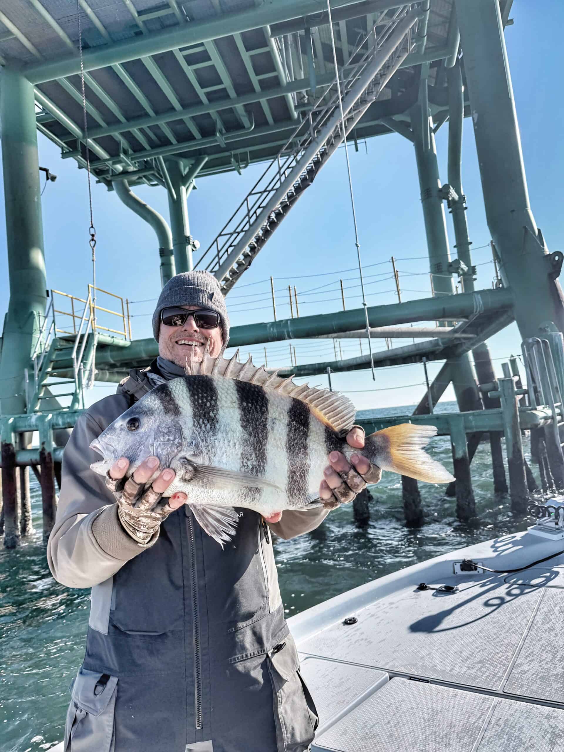 Kevin Hall holding a sheepshead caught during spring sheepshead fishing in Mobile Bay Alabama