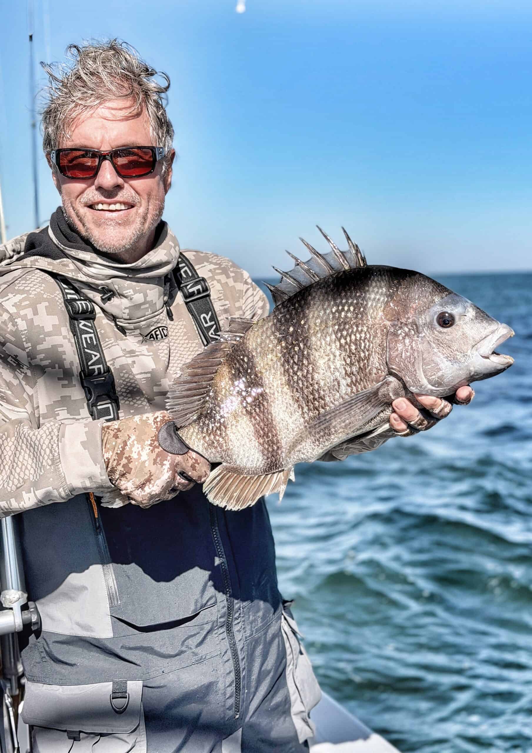 Mobile Bay fishing charter client Kevin Hall with a sheepshead caught near Fairhope Alabama